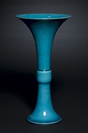 Beaker Vase in Form of Archaic Gu, 1662-1722. China, Jiangxi province, Jingdezhen kilns, Qing dynasty (1644-1912), Kangxi mark and reign (1662-1722). Porcelain with peacock-blue glaze; overall: 27.7 cm (10 7/8 in.).