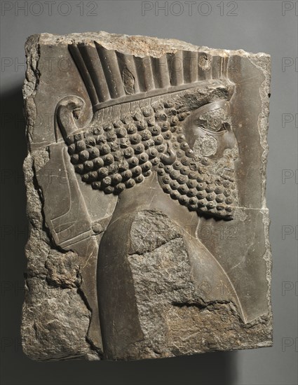 Fragment of a Wall Decoration from the Palace of Xerxes: "Guardsman" in Procession, 486-465 BC. Achaemenid, Iran, Persepolis, 5th Century BC. Gray limestone; overall: 53 x 43.6 cm (20 7/8 x 17 3/16 in.).