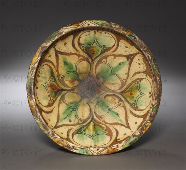 Bowl, 1100s-1200s. Northwest Iran, Aghkand (Azerbaijan area), 12th-13th century. Earthenware with underglaze slip-painted decoration; overall: 9.8 x 31 cm (3 7/8 x 12 3/16 in.).