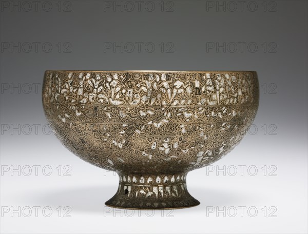The Wade Cup with Animated Script, 1200-1221. Iran, Seljuk Period, 13th Century. Brass inlaid with silver; diameter: 16.1 cm (6 5/16 in.); overall: 11.5 cm (4 1/2 in.).