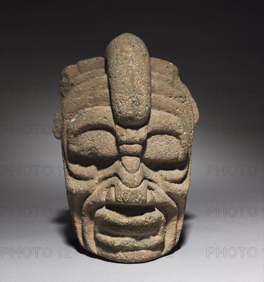 Head of a Wind God, 400-600. Mexico, Classic Veracruz (Totonac or Tajin), Early Classic, 5th-7th Century. Gray volcanic stone; overall: 21.1 x 15.3 x 16.2 cm (8 5/16 x 6 x 6 3/8 in.).