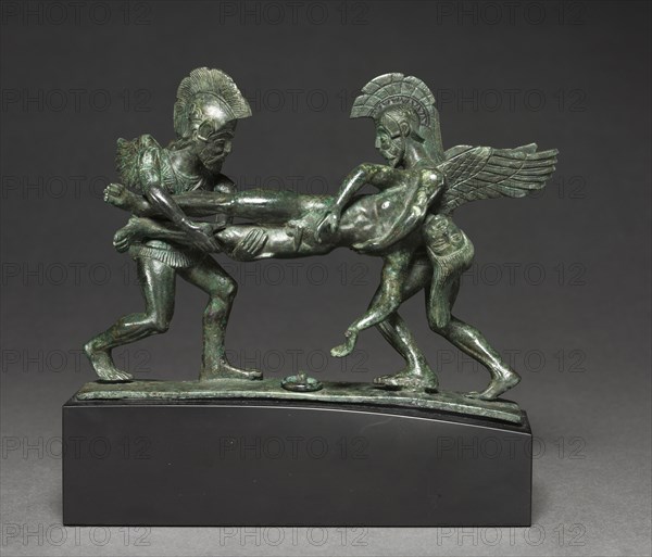 Sleep and Death Cista Handle, 400-375 BC. Italy, Etruscan, early 4th Century BC. Bronze; with base: 18.5 x 18.3 cm (7 5/16 x 7 3/16 in.); without base: 14 x 17.4 cm (5 1/2 x 6 7/8 in.).