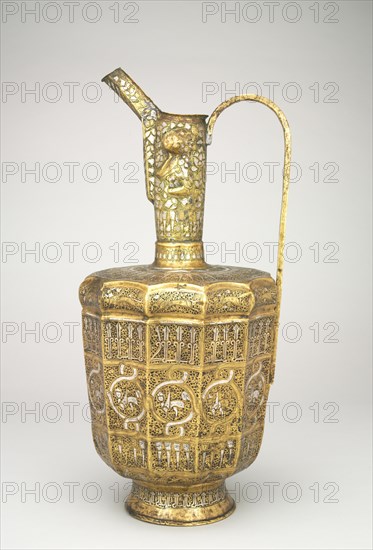 Twelve-sided Ewer with Sphinxes and Humanheaded Inscriptions, 1300-1350. Iran, Khurasan, Ilkhanid period, 14th century. Hammered sheet of brass inlaid with silver; overall: 44.8 cm (17 5/8 in.).