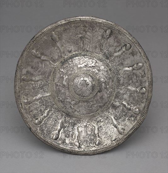 Dish with Tambourine Players, 700-600 BC. Phoenicia, 7th Century BC. Silver, partially gilt; overall: 1.3 x 19.5 x 19.5 cm (1/2 x 7 11/16 x 7 11/16 in.).