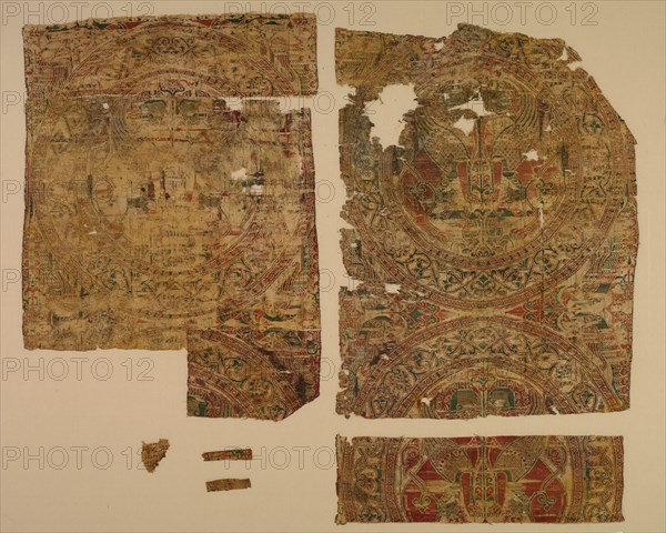 Lampas with confronted sphinxes in roundels, from the tomb of Saint Bernard Calvo, 1200-1243. Spain, Almeria, Almoravid period. Lampas, taqueté, and plain-weave variant: silk and gold thread; overall: 54 x 64.1 cm (21 1/4 x 25 1/4 in.)