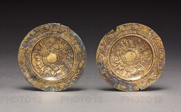 Pair of Ear Ornaments, c. 800-1370. Peru, North Coast, Sicán, 9th-14th century. Hammered and embossed gold alloy; diameter: 8.6 cm (3 3/8 in.); overall: 8.8 cm (3 7/16 in.).