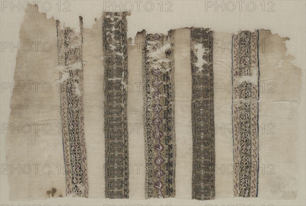 Fragment Composed of Parts of Three Tiraz-Style Textiles, 1094 - 1101. Egypt, Fatimid period, probably during Caliphate of al-Musta'li, AH 487-495 (A.D. 1094-1101). Tapestry (originally inwoven in a tabby ground); linen and silk; overall: 59.4 x 39.2 cm (23 3/8 x 15 7/16 in.).