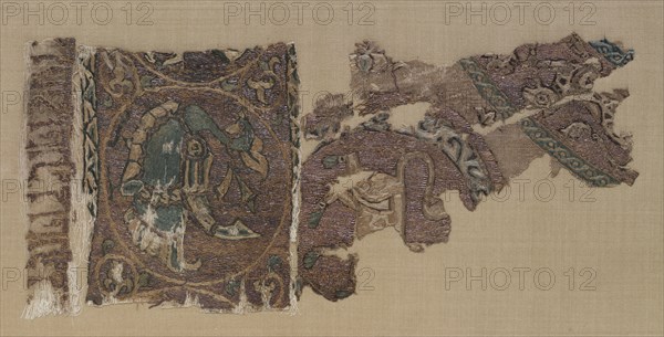 Embroidered border and field of animals in large roundels, 1000s-1100s. Iraq, probably Baghdad, Seljuk period. Plain weave: silk warp and cotton weft (mulham); embroidery, couched, split, running, and outline stitches: silk and gold thread; overall: 40 x 26 cm (15 3/4 x 10 1/4 in.)