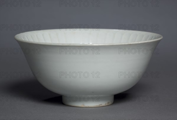 Bowl with Flower Petals, 1300s. China, Jiangxi province, Jingdezhen, Yuan dynasty (1271-1368). Glazed porcelain with molded decoration, Shufu ware; diameter: 17.2 cm (6 3/4 in.); overall: 7.9 cm (3 1/8 in.).