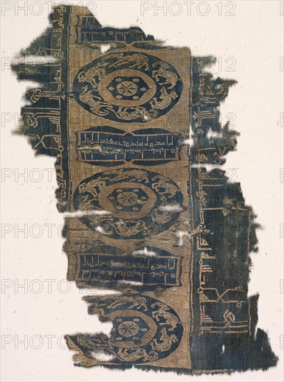 Brocaded silk fragment with running animal roundels and kufic inscriptions, 1530-1950. Iran. Lampas weave, brocaded; silk ; overall: 35.3 x 25 cm (13 7/8 x 9 13/16 in.).