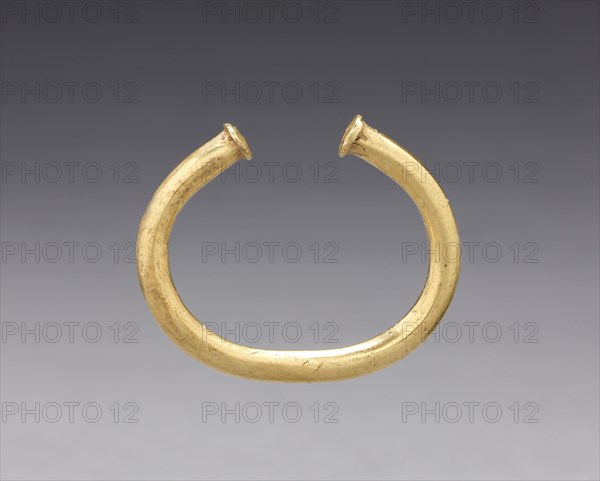 Nose Ornament, before 1550. Colombia, 16th century. Cast gold; overall: 3.1 x 3.8 x 0.4 cm (1 1/4 x 1 1/2 x 3/16 in.).
