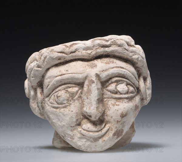 Female Head, 400s. Egypt, Coptic period, 5th Century. Limestone; overall: 9 x 10.2 cm (3 9/16 x 4 in.)