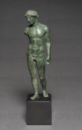 Athlete Making an Offering, c. 450-425 BC. Greece, probably from workshop of Locri or Tarentum, Classical Period. Bronze; overall: 21 cm (8 1/4 in.); without tang: 19.8 cm (7 13/16 in.).