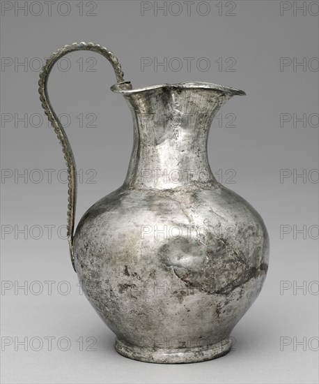 Ewer with a Trefoil (Three-Part) Spout, 300-600. Byzantium, Syria?, early Byzantine period, 4th century-7th century. Silver with niello; diameter: 8 cm (3 1/8 in.); overall: 20.7 x 13.1 cm (8 1/8 x 5 3/16 in.)