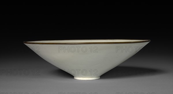 Bowl: Ding ware, 12th Century. China, Hebei province, Chuyang District, Jin dynasty (1115-1234). White porcelain; diameter: 21 cm (8 1/4 in.); overall: 6.4 cm (2 1/2 in.).