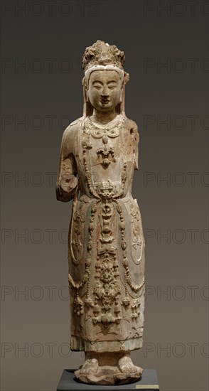 Bodhisattva Guanyin, late 500s-early 600s. China, late Northern Qi (550-577) or early Sui dynasty (581-618). Sandstone with polychromy; overall: 138.8 x 38.2 x 27.4 cm (54 5/8 x 15 1/16 x 10 13/16 in.).