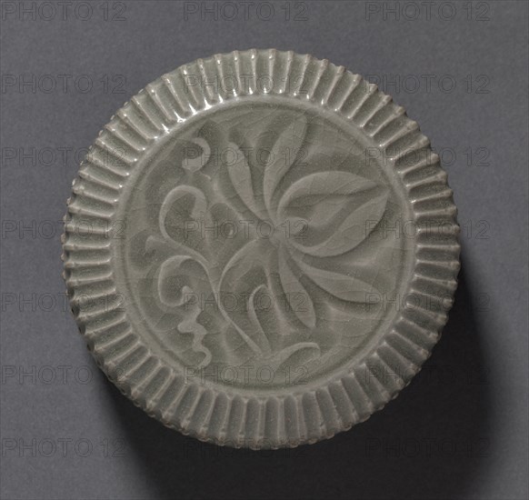Covered Box with Carved Floral Design: Yaozhou Ware (lid), 1100s. China, Shanxi province, Northern Song dynasty (960-1127). Glazed stoneware; diameter: 10.7 cm (4 3/16 in.); overall: 5.2 cm (2 1/16 in.).