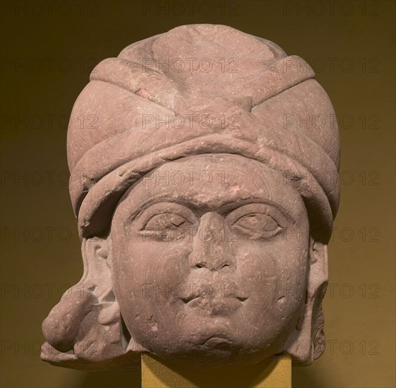 Head of a Yaksha, c. 125 BC. Northern India, Uttar Pradesh, Mathura, Shunga Period (c. 187-78 BC). Mottled red sandstone; overall: 48.2 x 40 x 35.6 cm (19 x 15 3/4 x 14 in.).
