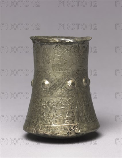 Hero and Animal Combat Beaker, 900-700 BC. Iran, Luristan, 9th-7th Century BC. Silver, repoussé, engraved; diameter: 7.7 cm (3 1/16 in.); overall: 10.1 cm (4 in.).