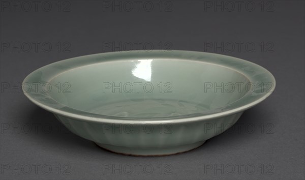 Dish with Two Fish in Relief:  Longquan Ware, mid-1200s. China, Zhejiang province, Southern Song dynasty (1127-1279). Glazed porcelain with molded decoration; diameter: 21.3 cm (8 3/8 in.); overall: 5.1 cm (2 in.).