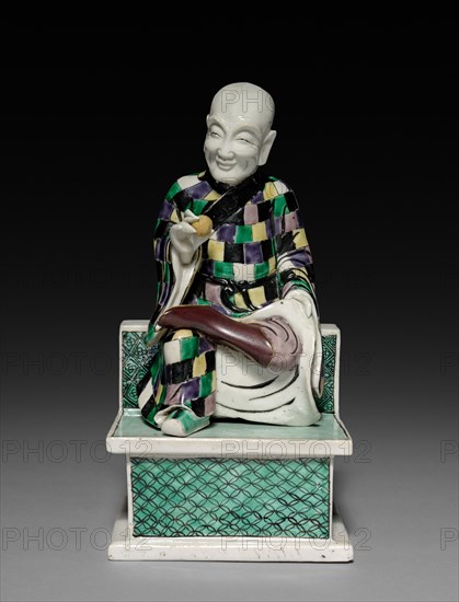 Lohan Holding a Peach, 1662-1722. China, Jiangxi province, Jingdezhen kilns, Qing dynasty (1644-1912), Kangxi reign (1661-1722). Porcelain with famille verte overglaze enamel decoration; overall: 24.3 x 12.6 cm (9 9/16 x 4 15/16 in.).