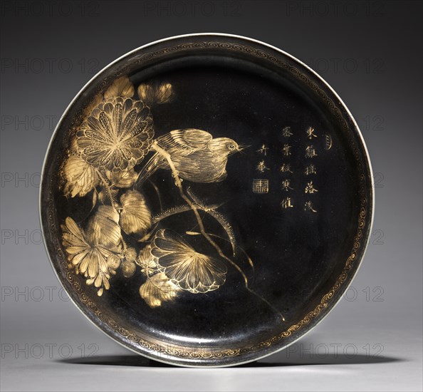 Dish with Bird on Chrysanthemum Spray, 1661-1722. China, Jiangxi province, Jingdezhen kilns, Qing dynasty (1644-1911), Kangxi reign (1661-1722). Porcelain with mirror black glaze painted with gold decoration; diameter: 20.4 cm (8 1/16 in.).