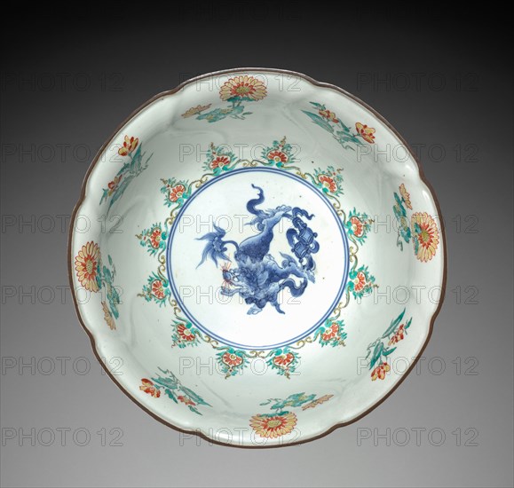 Bowl with Lion (Kara-shisi) and Floral Decoration: Kakiemon Type, 18th century. Japan, Edo Period (1615-1868). Porcelain, molded, with underglaze blue and overglaze enamel decoration, "kin" mark in underglaze blue; diameter: 25.1 cm (9 7/8 in.); overall: 10.9 cm (4 5/16 in.).