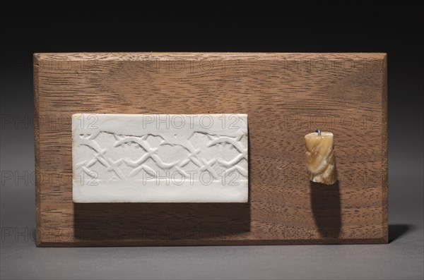 Cylinder Seal, c. 3000 BC. Mesopotamia, Early Dynastic period. Agate; diameter: 1.9 x 1.1 cm (3/4 x 7/16 in.); with mount: 2.9 x 13.8 x 7.7 cm (1 1/8 x 5 7/16 x 3 1/16 in.).
