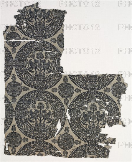 Fragments with Griffins in Roundels, 1100s. Iran or Iraq, Seljuk period, 12th century. Lampas weave, silk; average: 41 x 32.8 cm (16 1/8 x 12 15/16 in.)