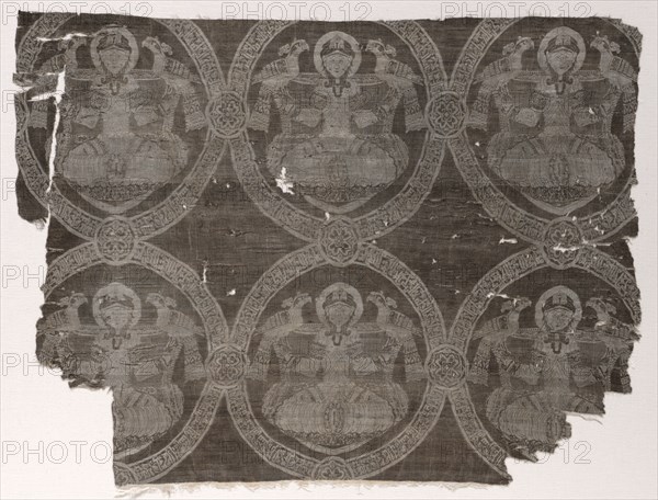 Lampas fragment with seated prince holding falcons in kufic medallions, 1654-1955. Probably Iran. Lampas weave, silk; overall: 63.5 x 47.6 cm (25 x 18 3/4 in.)