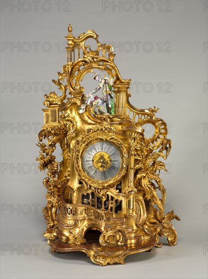 Clock, c. 1750. Baumgartinger (German). Carved and gilded wood, faience; overall: 97.8 x 59.7 x 37.2 cm (38 1/2 x 23 1/2 x 14 5/8 in.).