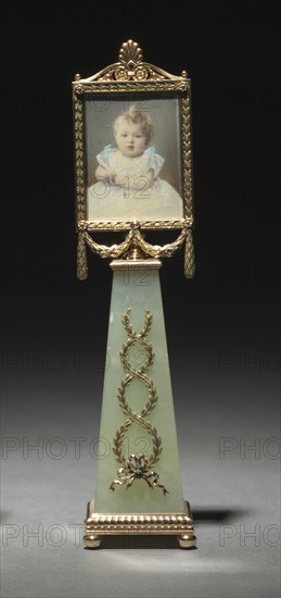 Framed Miniature: Portrait of Grand Duchess Olga, before 1896. Mikhail Evlampievich Perkhin (Russian, 1860-1903), firm of Peter Carl Fabergé (Russian, 1846-1920), Johannes Zehngraf (Russian, 1857-1908). Gold, rubies, diamonds, gouache, ivory, glass; overall: 15.3 x 5 x 5 cm (6 x 1 15/16 x 1 15/16 in.).