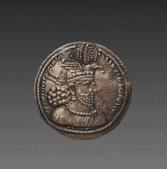 Drachma:  Bust of Hormizd II (obverse), 303-309. Sasanian, Iran, reign of Hormizd II, 4th century. Silver; diameter: 2.6 x 0.1 cm (1 x 1/16 in.).