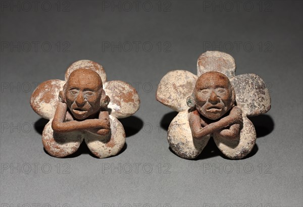 Pair of Figure in Flower Ornaments, 500-900. Mexico, Yucatán, Jaina Island region, Campeche, Maya style (250-900). Earthenware with slip; diameter: 3 cm (1 3/16 in.).