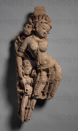Female Tree Deity with Attendant, c. 973. Northwestern India, Rajasthan, Sikar, Harshagiri, 10th century. Sandstone; overall: 54.6 cm (21 1/2 in.).