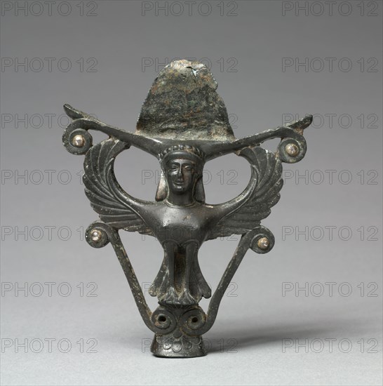 Mirror Support: Siren, c. 475 BC. Greece, Corinth, presumably of Corinthian or Argive origin, 5th Century BC. Bronze with silver inlays; overall: 11.5 x 9 cm (4 1/2 x 3 9/16 in.).