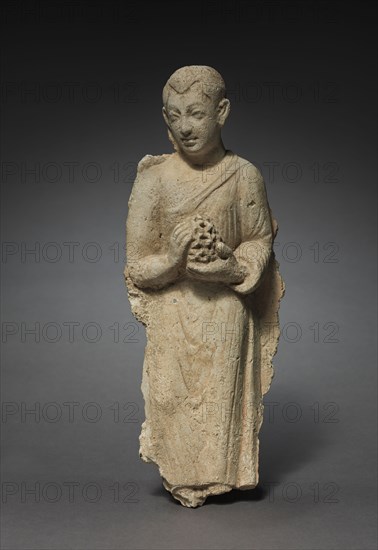 Layman Bearing Offerings, c. 300s. Afghanistan or Pakistan, Gandhara, probably Hadda, late Kushan Period (1st century-320). Stucco; overall: 27.3 cm (10 3/4 in.).