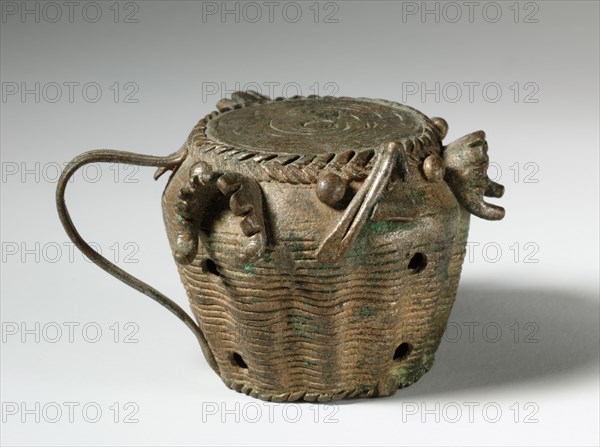 Gold Weight: Drum with Jaws of Defeated Enemies, 1800s. Guinea Coast, Ghana, Asante, 19th century. Brass, bronze; overall: 3.6 x 5.3 cm (1 7/16 x 2 1/16 in.)