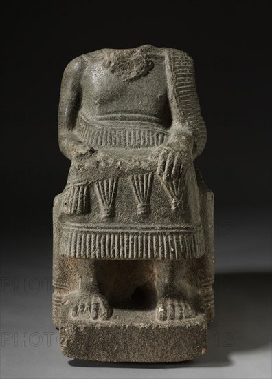 Seated Ruler, 2000-1700 BC. North Syria, possibly the area of Ebla, 2000-1700 BC. Limestone with shell inclusions; overall: 66.7 x 38.2 x 54.6 cm (26 1/4 x 15 1/16 x 21 1/2 in.).