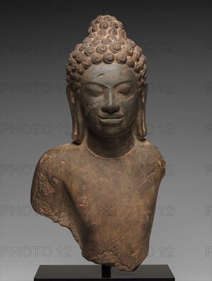 Bust of Buddha, c. 700. Central Thailand, Dvaravati, Mon-Dvaravati style, 7th-9th Century. Limestone; overall: 60.6 x 34.3 cm (23 7/8 x 13 1/2 in.).