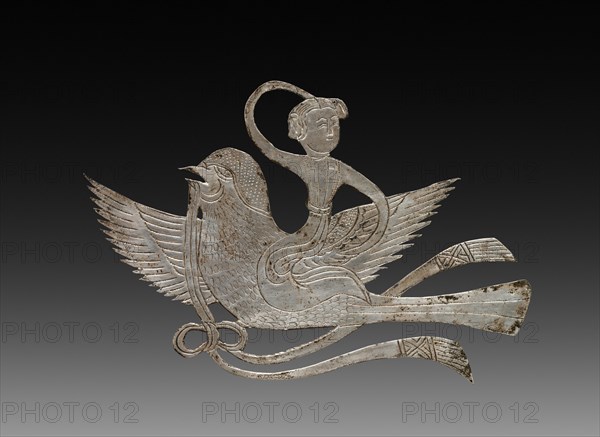 Inlay for a Mirror or Box: Lady on a Bird, c. 900-1000. China, Tang dynasty (618-907) - Song dynasty (960-1279). Beaten silver with chased details; overall: 5.2 x 7.8 cm (2 1/16 x 3 1/16 in.).
