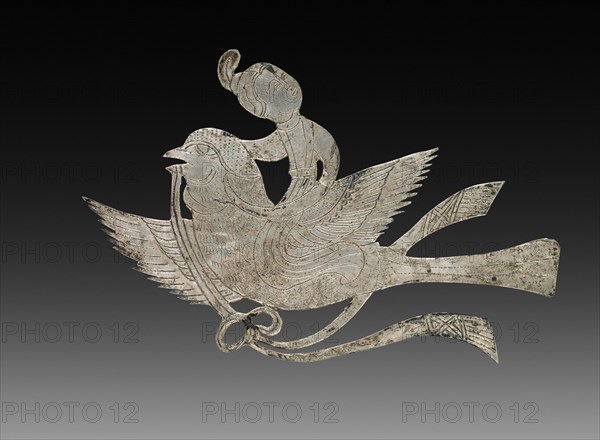 Inlay for a Mirror or Box: Lady on a Bird, c. 900-1000. China, Tang dynasty (618-907) - Song dynasty (960-1279). Beaten silver with chased details; overall: 5.3 x 8.4 cm (2 1/16 x 3 5/16 in.).