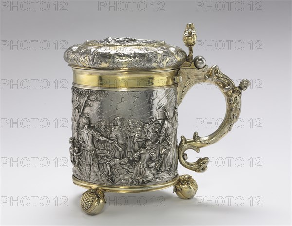 Tankard, c. 1680. Andreas Brachfeldt (Russian, born Latvia, active 1661-1697). Cut and seamed silver sheet, repoussé and chased ornament, cast handle and feet, partially gilded; diameter: 17.5 cm (6 7/8 in.); overall: 26.5 x 26.4 cm (10 7/16 x 10 3/8 in.).