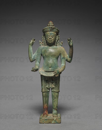 Standing Ashura with Four Arms, 925-950. Cambodia, Koh Ker style, 2nd quarter of 10th Century. Bronze; overall: 17.2 cm (6 3/4 in.).