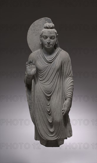 Standing Buddha, 150-200. Pakistan, Gandhara, Kushan Period. Schist; overall: 119.7 cm (47 1/8 in.); head: 1.5 x 3.2 cm (9/16 x 1 1/4 in.).