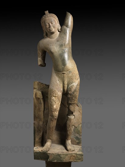 Krishna Lifting Mount Govardhan, c. 600. Southern Cambodia, Takeo Province, Phnom Da, Pre-Angkorean period (600-802). Sandstone; overall: 244 cm (96 1/16 in.); without base: 200.8 cm (79 1/16 in.); mounted: 317.4 x 44.5 x 44.5 cm (124 15/16 x 17 1/2 x 17 1/2 in.).