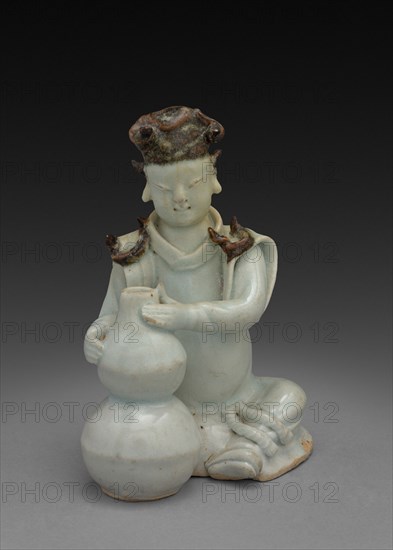 Potter Seated with Double Gourd Vase:  Ch'ing-pai Ware, 14th Century. China, Yuan dynasty (1271-1368) - Ming dynasty (1368-1644). Porcelain with underglaze decoration; overall: 13.5 cm (5 5/16 in.).