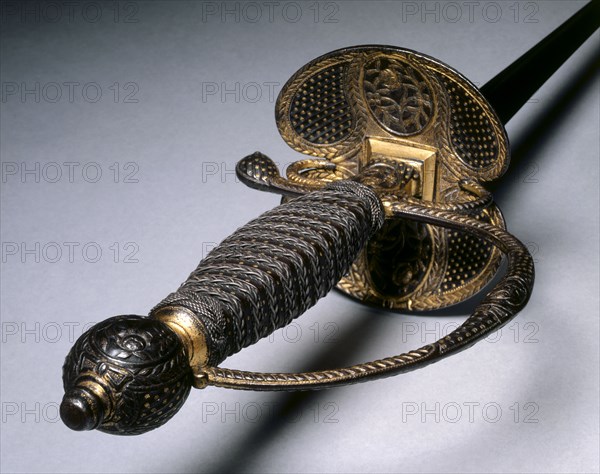 Small Sword, c. 1780. France, Paris (?), 18th century. Forged steel blade; partially gilt and russet steel hilt; steel wire, leather bands, wood core; overall: 103.5 cm (40 3/4 in.); blade: 86.1 cm (33 7/8 in.); guard: 8.3 cm (3 1/4 in.).