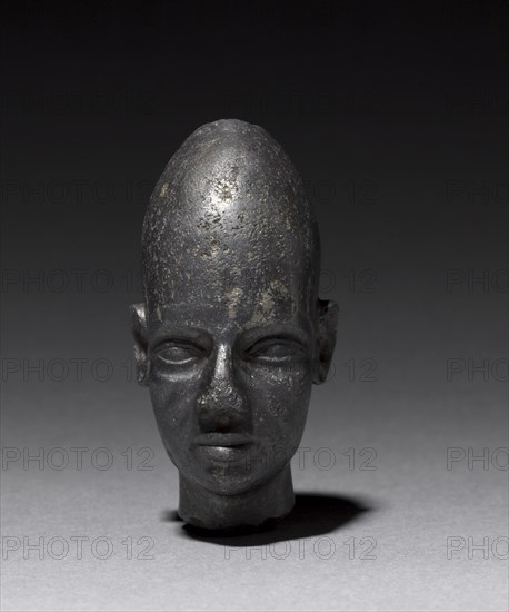 Head of Foreign God or Prince, c. 1320 BC. Egypt or Syria, late Dynasty XVIII. Black magnetite; overall: 7 cm (2 3/4 in.).