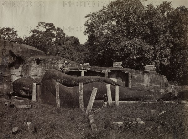The Paranirvana of Buddha, Gal Vihara, Polonnaruva, Ceylon, 1870-1871. Joseph Lawton (British, d. 1874). Albumen print; image: 21.4 x 28.2 cm (8 7/16 x 11 1/8 in.); matted: 35.6 x 45.7 cm (14 x 18 in.)